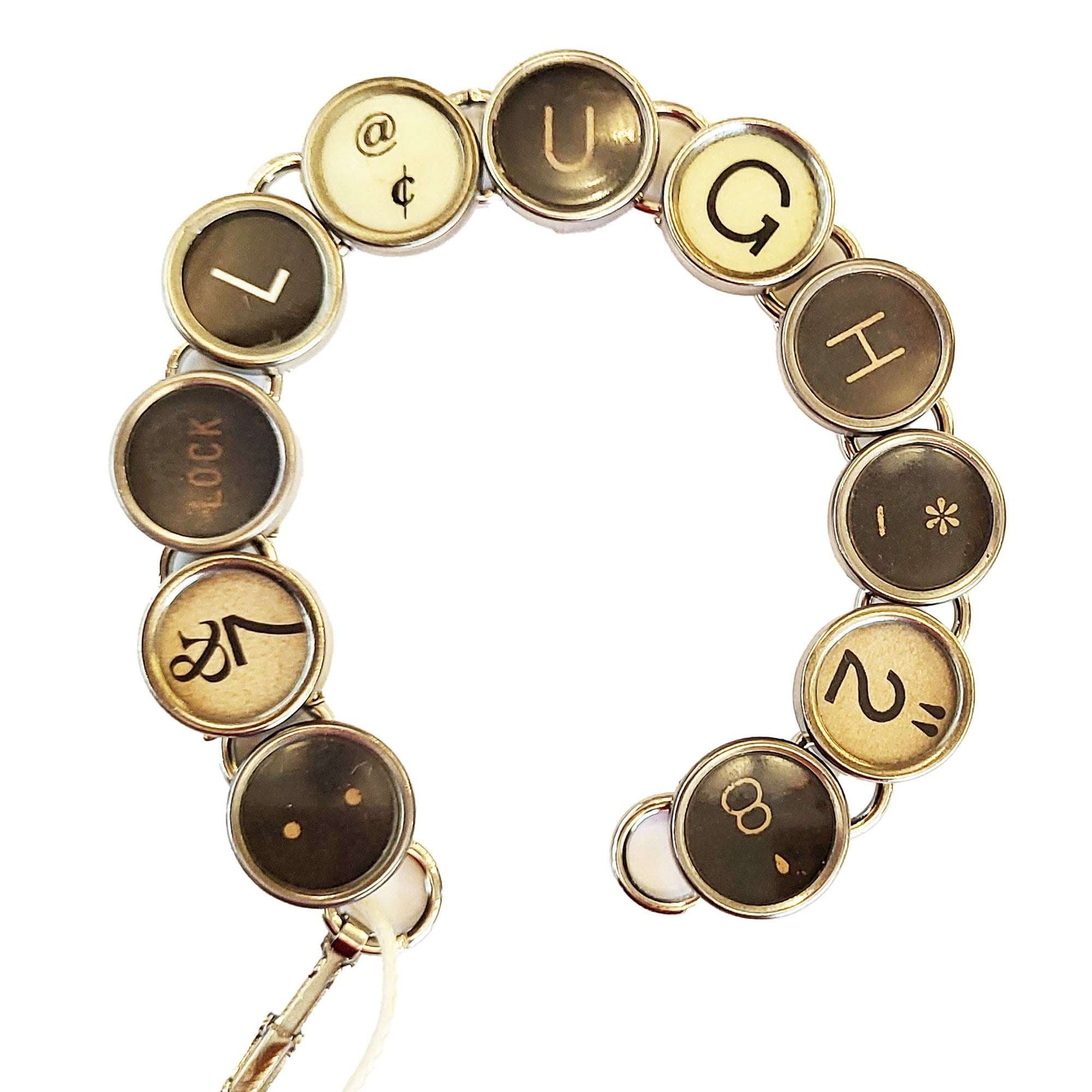 Typewriter Key Bracelet that spells LAUGH